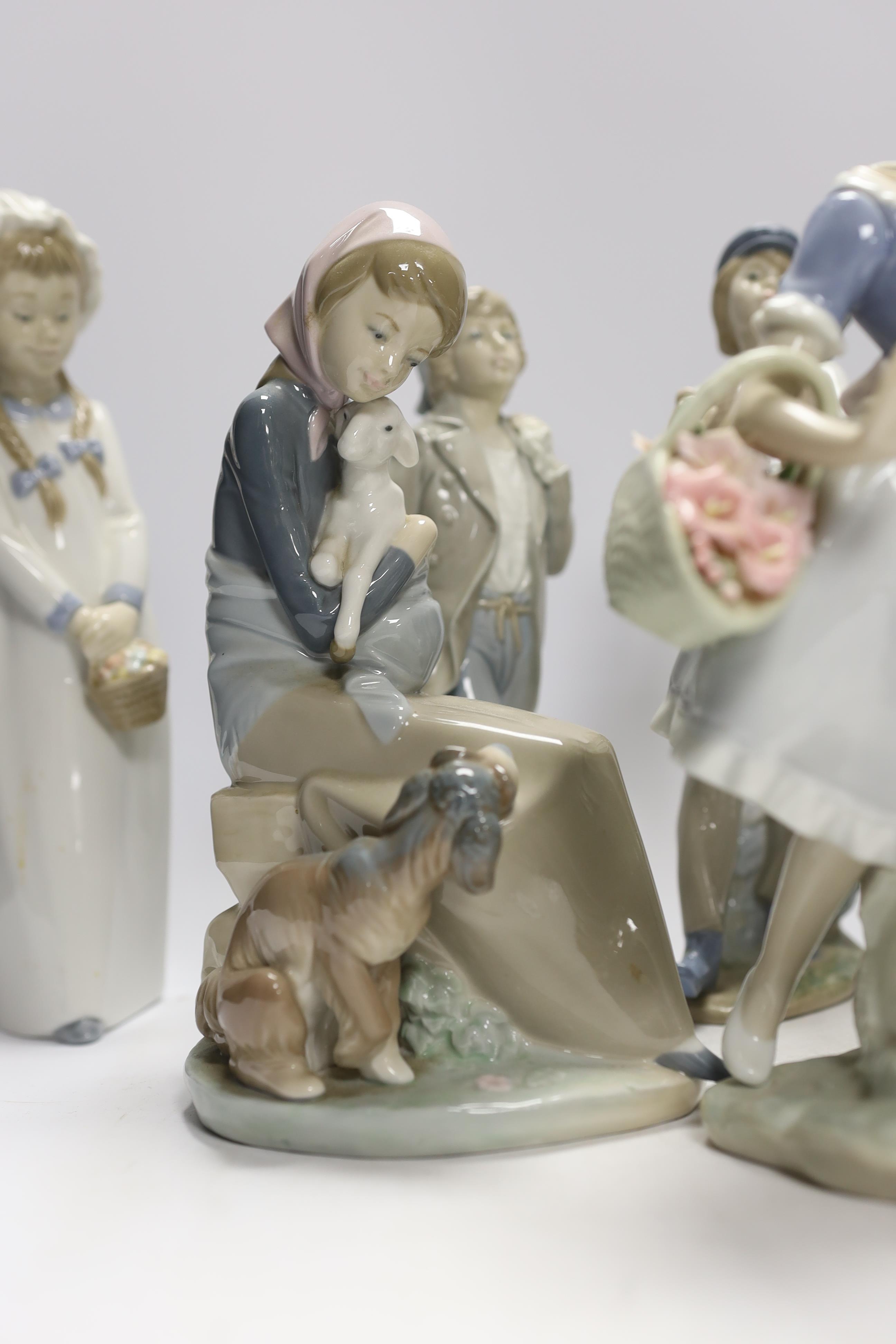 Ten Lladro and Nao figures including a short eared owl and a girl with braids, largest 26cm high